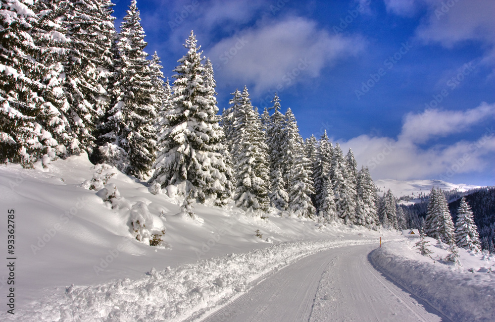 Fototapeta premium Mountain road covered with snow