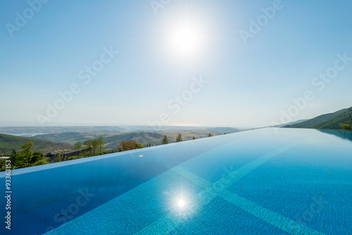 Infinity pool on the bright summer day © Elnur