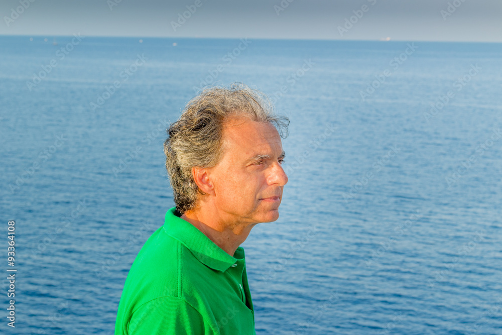 charming man relaxing in a rocky coast charming man relaxing in a rocky coast