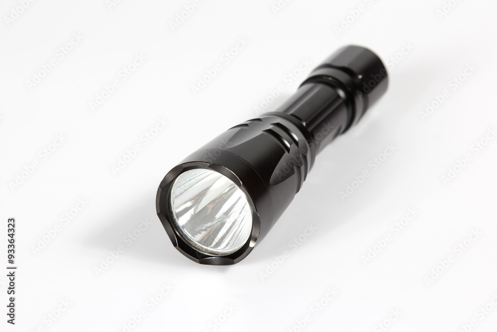 black flashlight on white background black flashlight on white background