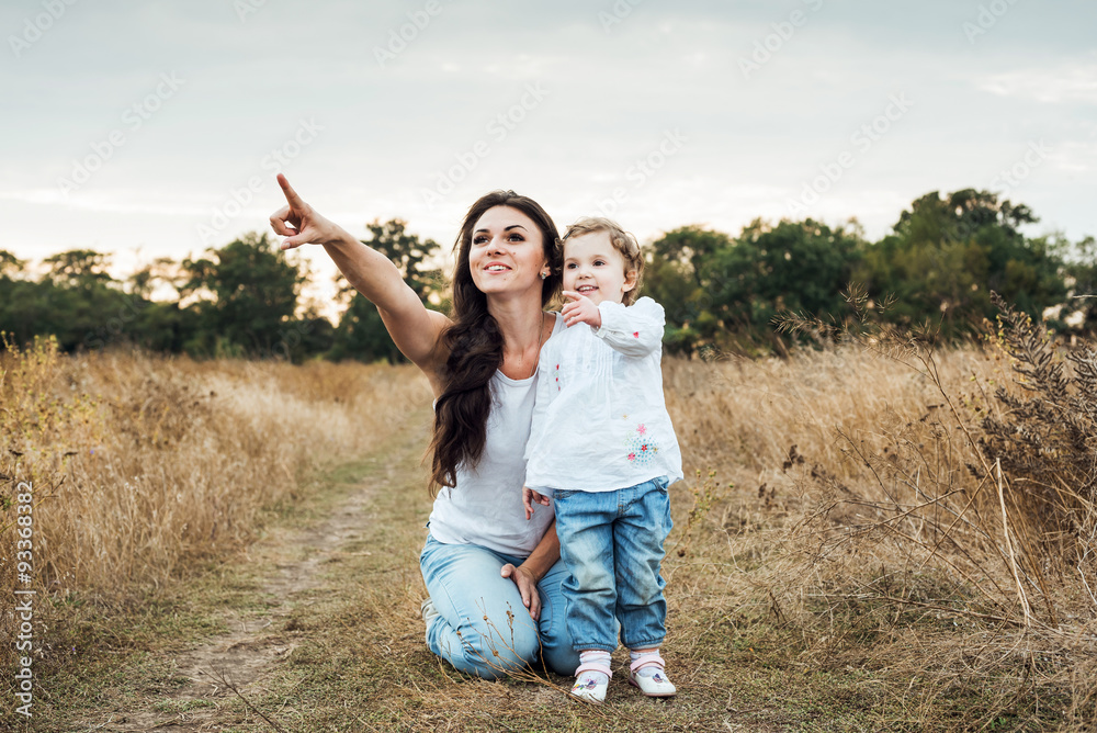 mother and daughter playing on autumn field together, loving family having fun outdoors mother and daughter playing on autumn field together, loving family having fun outdoors