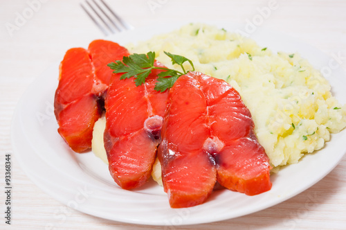 salmon steak with mashed potatoes on the plate