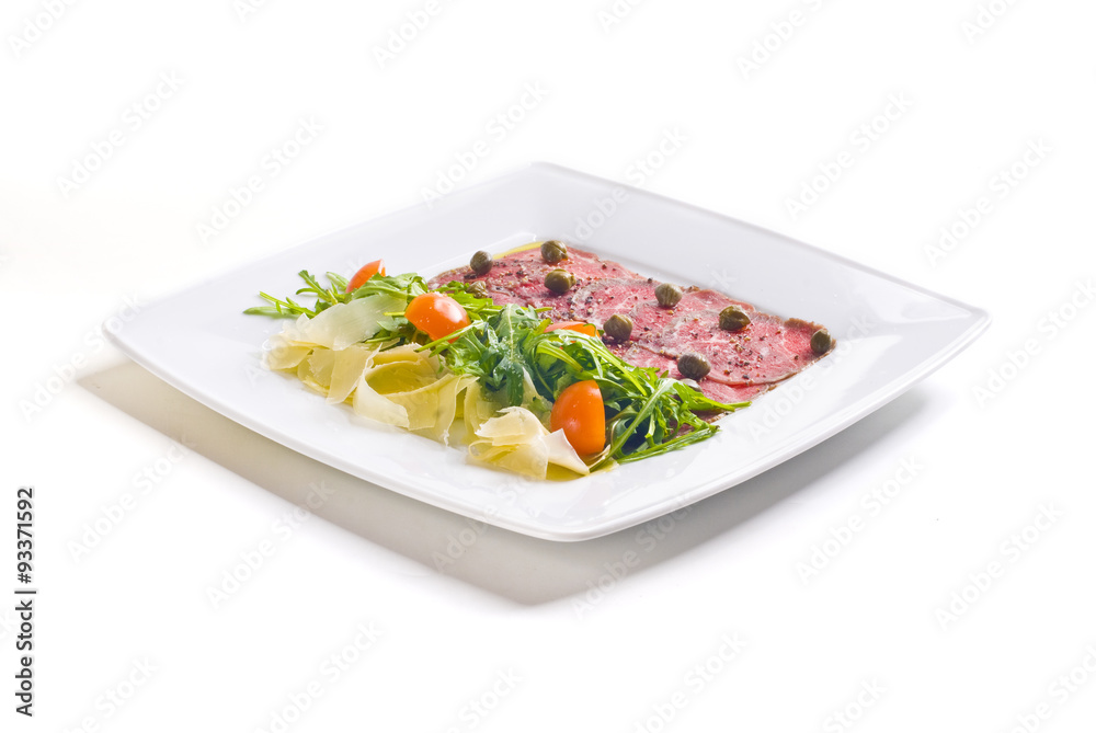 Carpaccio with parmesan cheese, arugula and capers