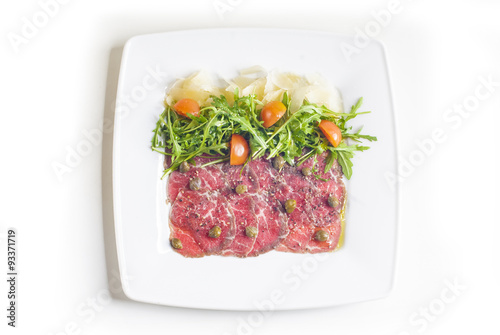 Obraz na płótnie Carpaccio with parmesan cheese, arugula and capers w salonie