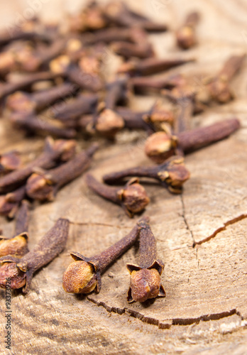 Cloves on a wood board.