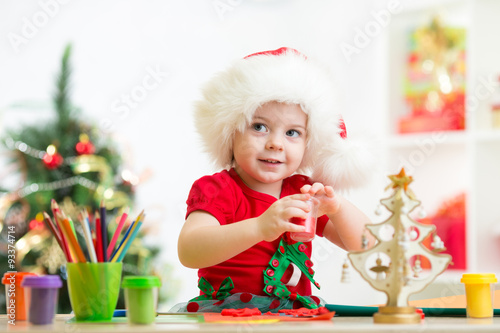 child girl making christmas...