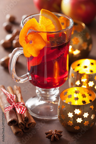 glass of mulled wine with orange and spices, winter drink