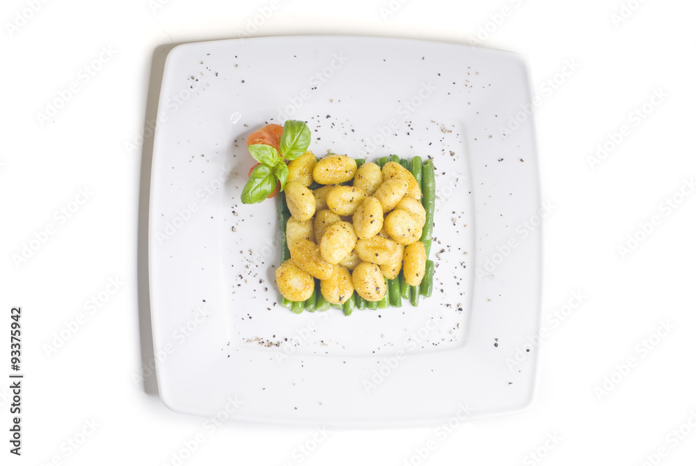 Gnocchi on green beans with tomato