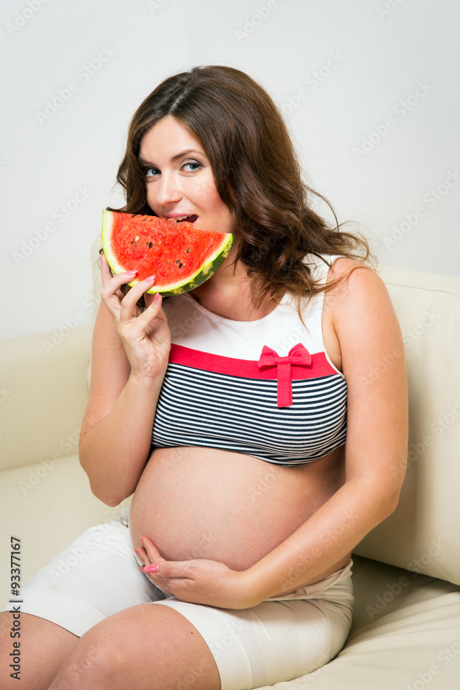 Pregnant woman with watermelon