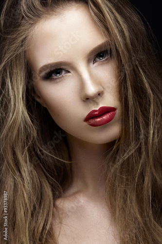 Beautiful woman with evening make-up and long straight hair