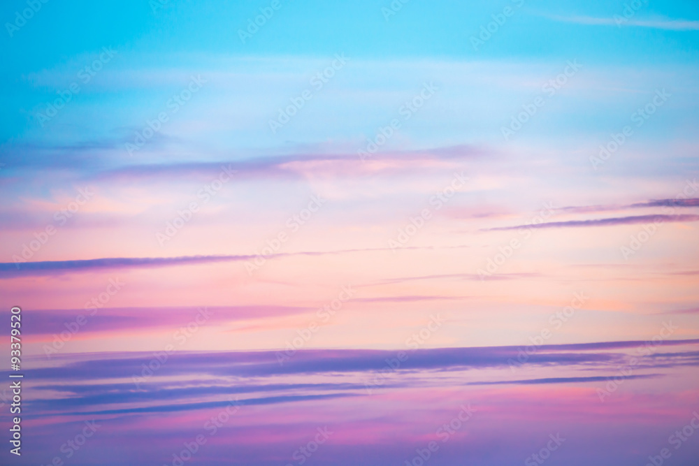 Pale sunset sky with pink, orange and red colors