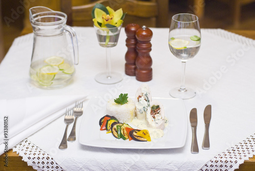 Obraz na płótnie Turkey rolls with gorgonzola cheese, dried tomatoes and spinach stuffing with grilled vegetables and rice w salonie