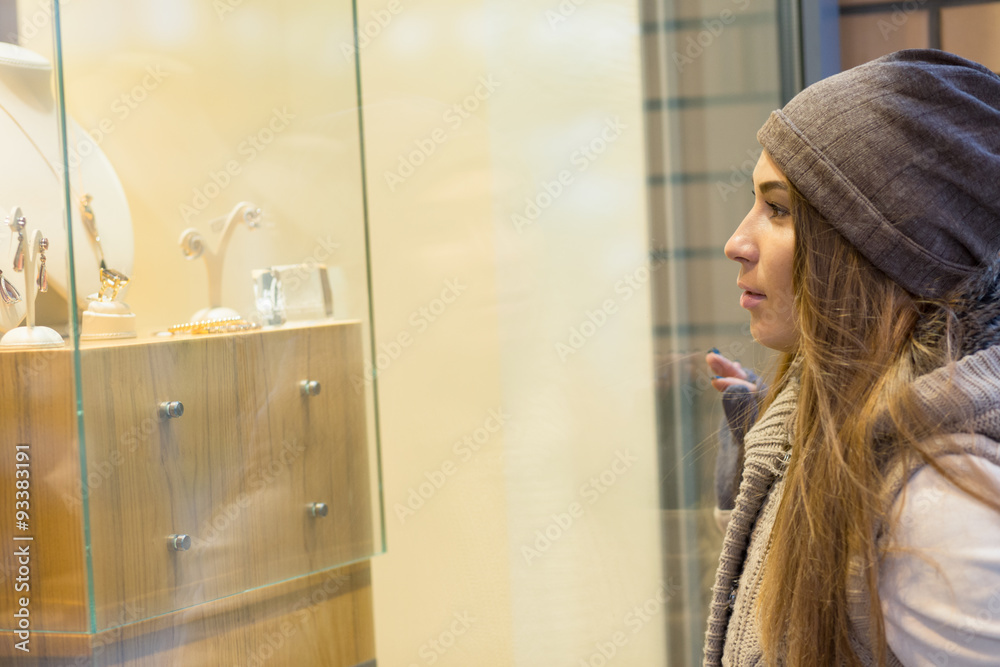 Woman see at items in showcase Woman see at items in showcase