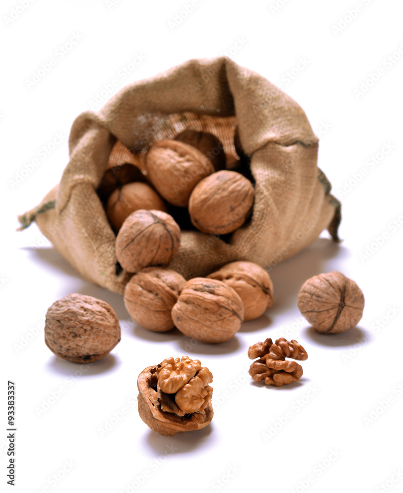 Walnuts and a bag on white Walnuts and a bag on white