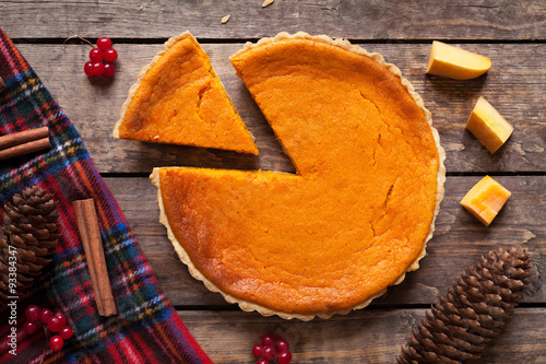 Homemade sliced pumpkin tart pie recipe with cinnamon and nuts