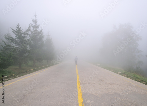 Silhouette of man in misty fog