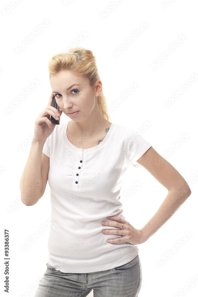 Young happy caucasian woman looking to camera with a mobile phon Young happy caucasian woman looking to camera with a mobile phon