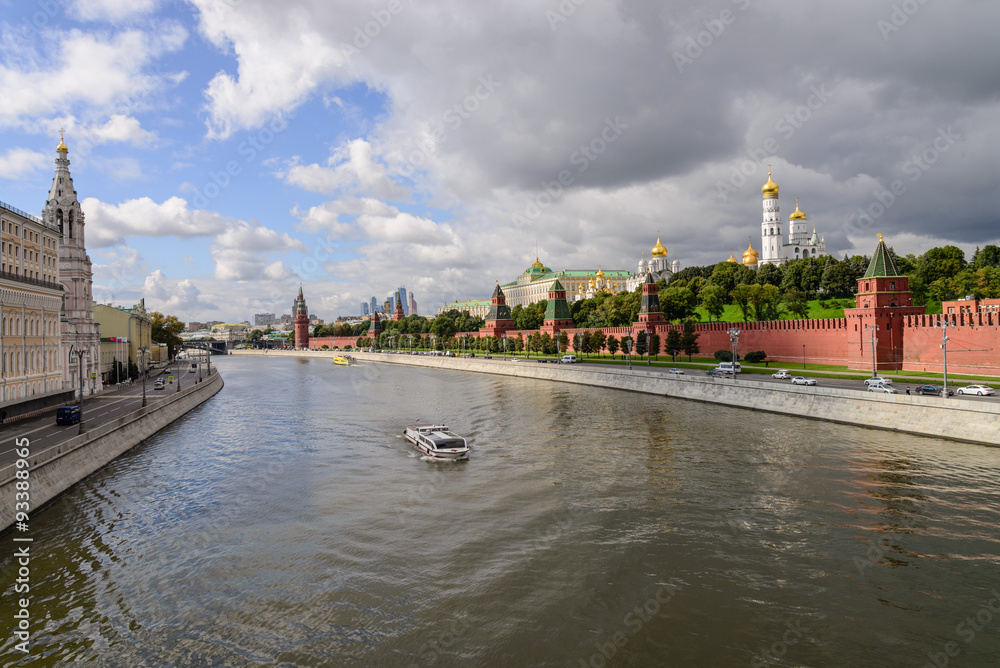 Kremlin embankment at the Moscow center with the kremlin wall, Moskva river and boat on it