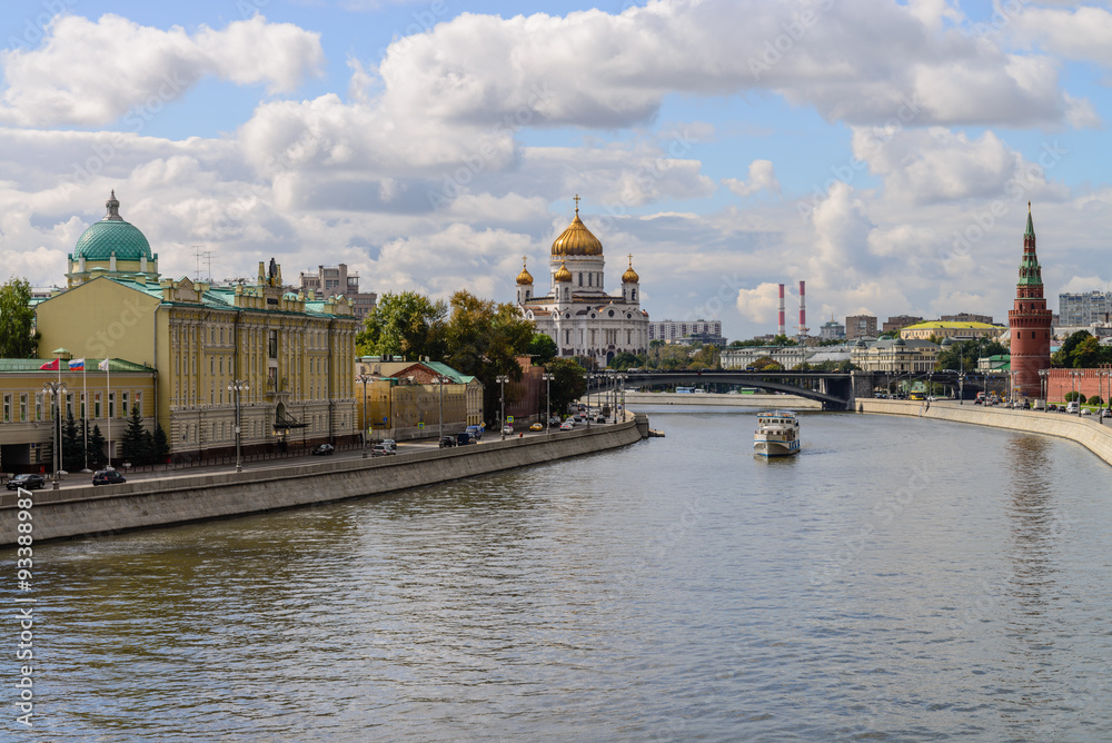 Kremlin embankment at the Moscow center with the kremlin wall, Moskva river and boat on it