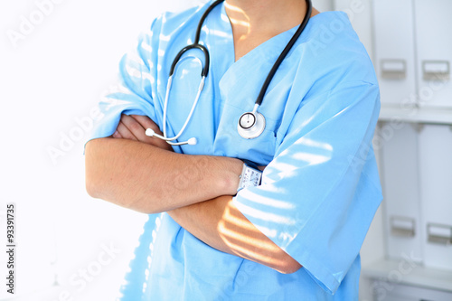 Portrait of unknown male surgeon doctor holding his stethoscope
