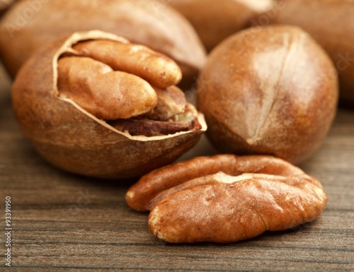 pecan nuts on wooden background
