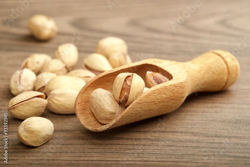 pistachio nuts on wooden background