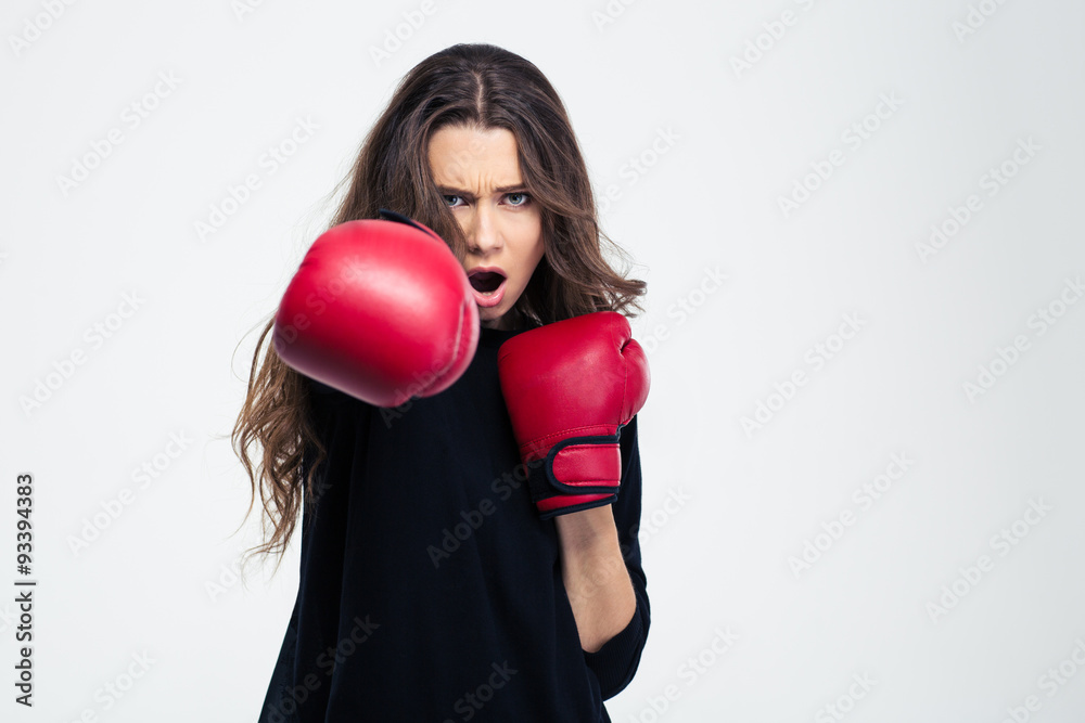 Woman in boxing gloves hitting at camer Woman in boxing gloves hitting at camer