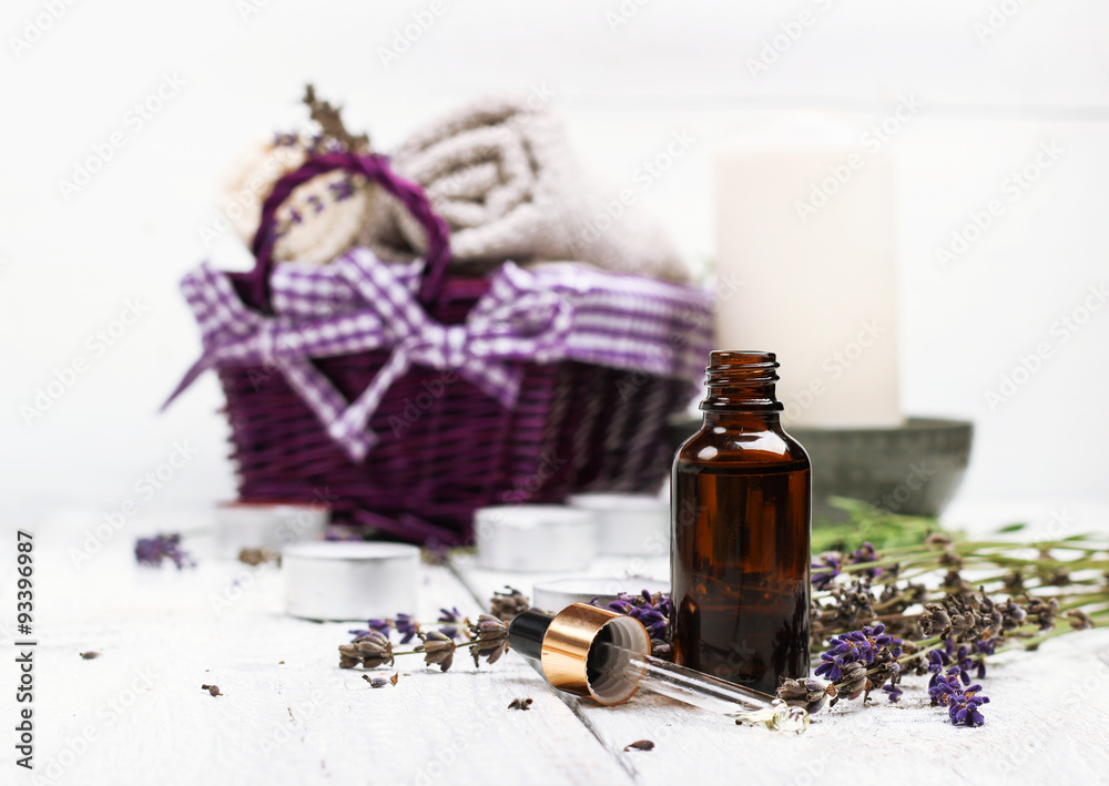 Dry lavender and oil on a white wooden table Dry lavender and oil on a white wooden table