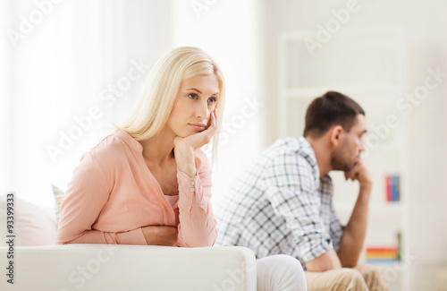 unhappy couple having argument at home