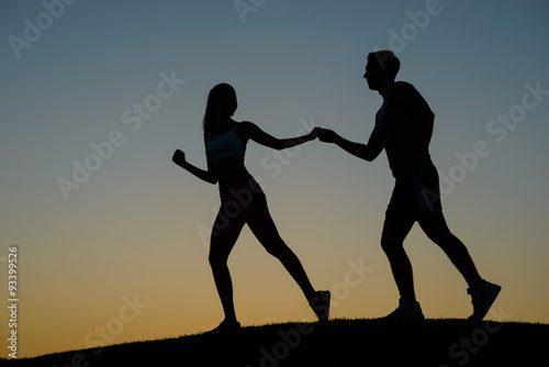 Guy and girl holding hands. © DenisProduction.com