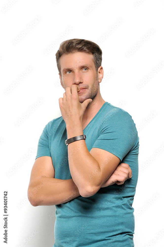 A handsome mature man smiling at the camera against a white background A handsome mature man smiling at the camera against a white background
