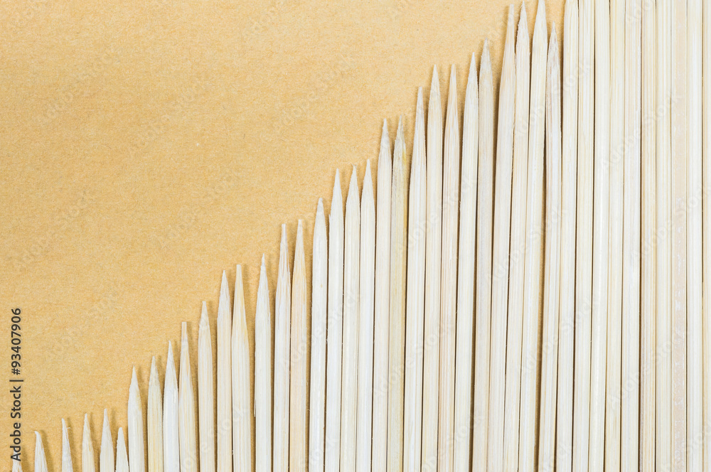 Wood stick for meatball skewers on brown paper texture background Wood stick for meatball skewers on brown paper texture background