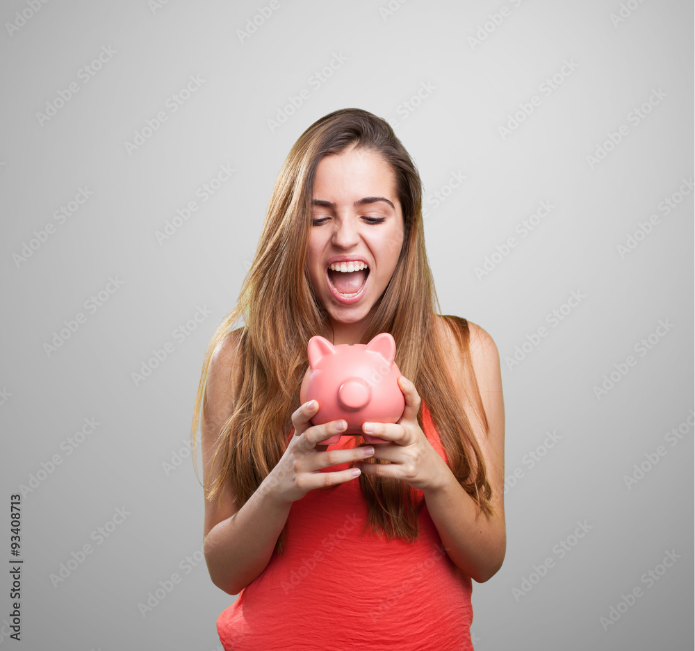 young cute woman shouting to her piggy bank