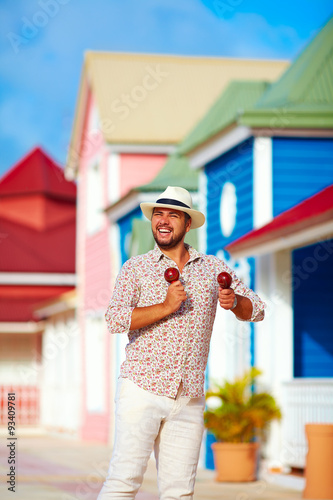 Photography happy street musician dancing on caribbean street