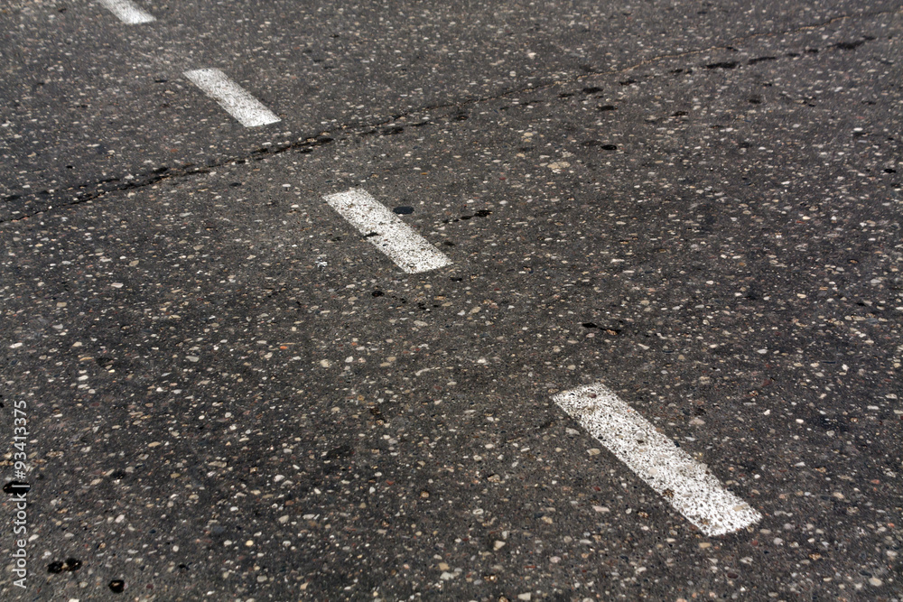 Fototapeta premium Damaged asphalt texture.