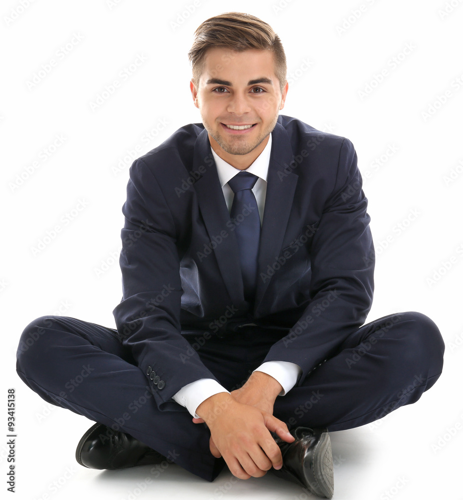 Elegant man in suit sitting isolated on white Elegant man in suit sitting isolated on white