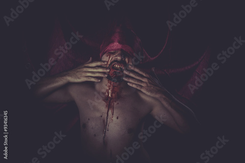 Fototapeta Naklejka Na Ścianę i Meble -  Fantasy, naked man on large red cloth over his eyes