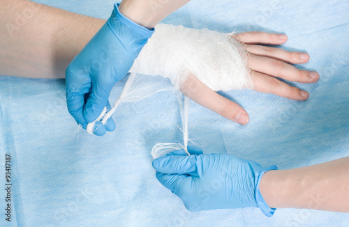 nurse bandages hand