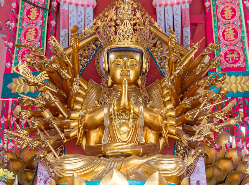 golden seated buddha statue in temple