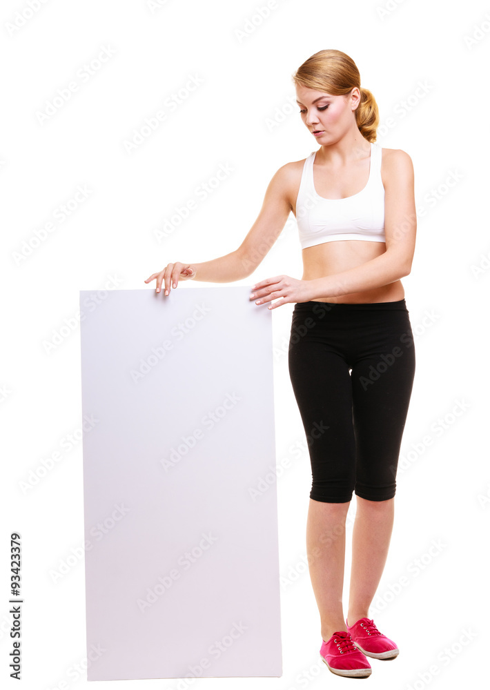 Fitness sporty woman holding blank empty ad banner Fitness sporty woman holding blank empty ad banner