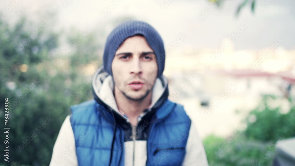 Portrait of serious, young man in park, slow motion 120fps
Portrait of serious, young man in park, slow motion 120fps