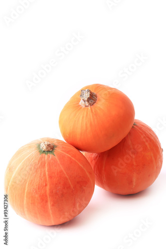 three pumpkins isolated on a white background
