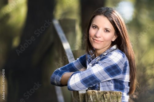 Woman Leaning on Fence