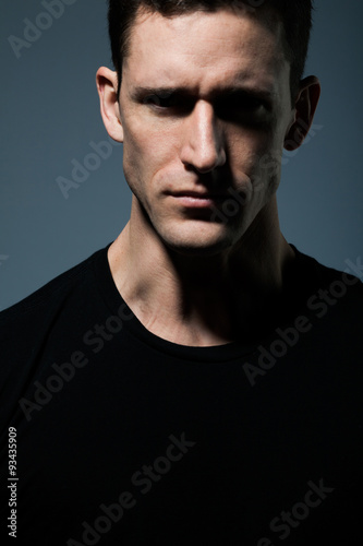 Young man in black shirt.