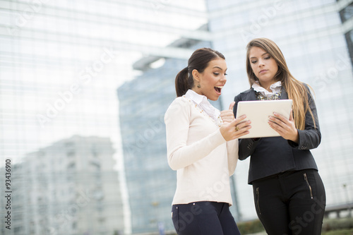Young business women in front of office building
