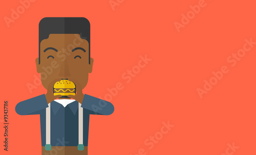 Man eating hamburger. 