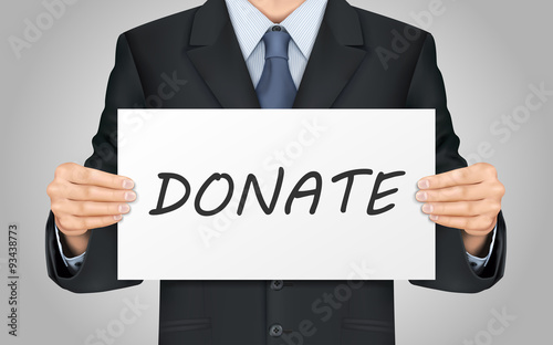 businessman holding donate poster
