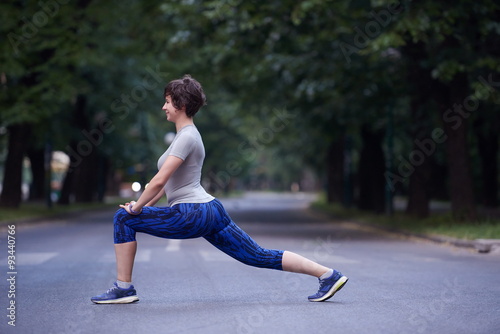 woman stretching before morning jogging