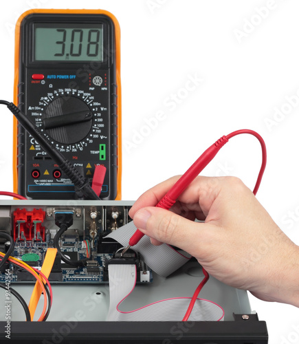Technician checks the battery in an electronic device. Objects isolated on white background without shadows. Image with shallow DOF.