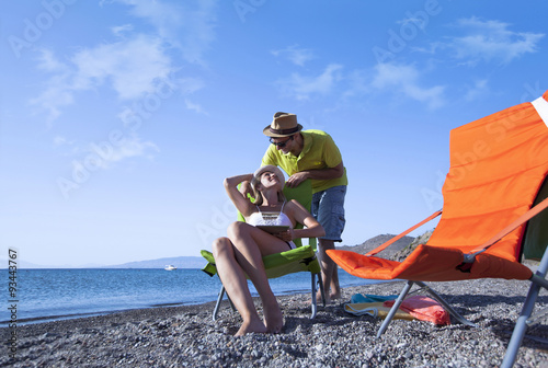 Young couple is having fun at the beach on a summer day